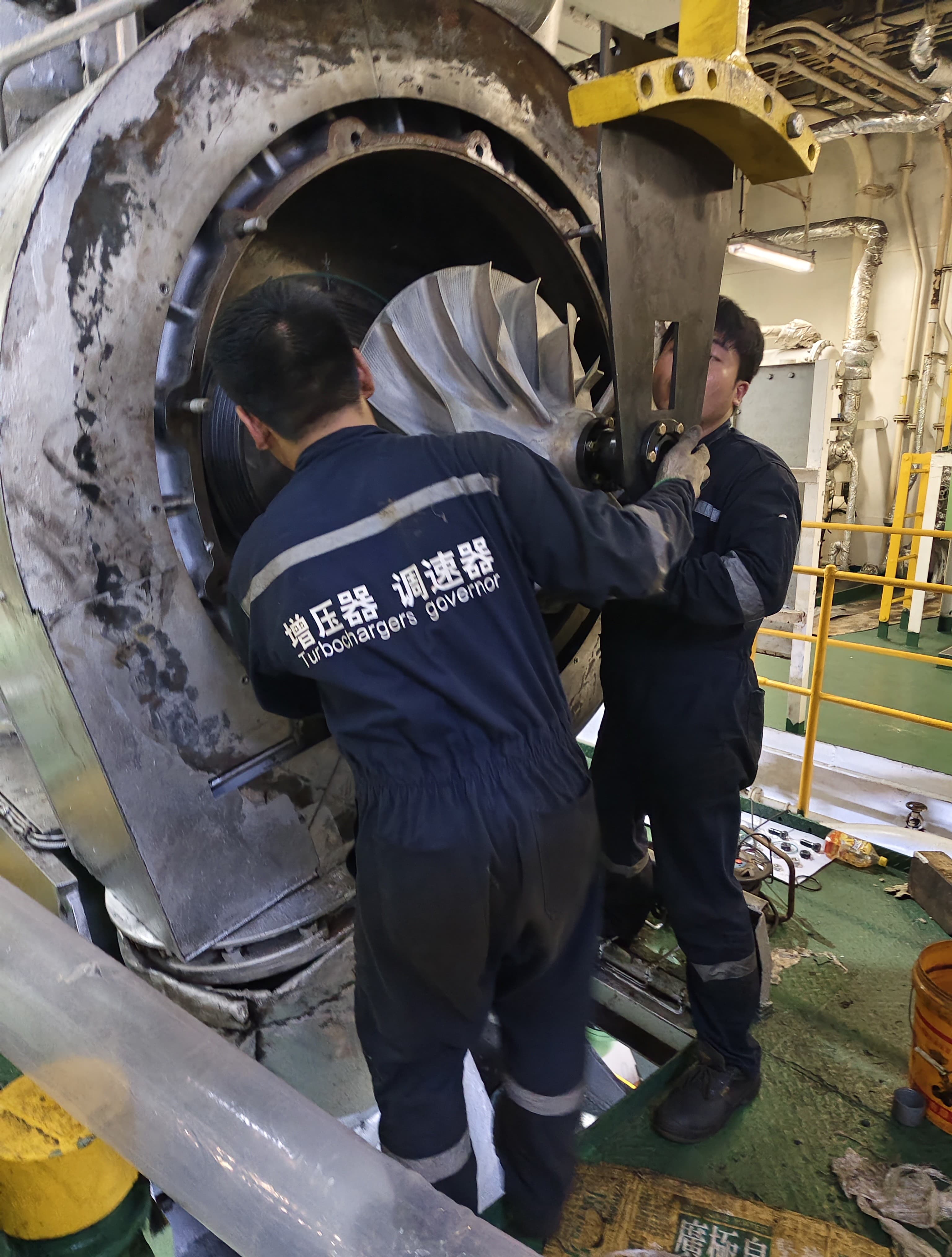 SHENGDA MARINE engineers working on a marine turbocharger onboard a vessel