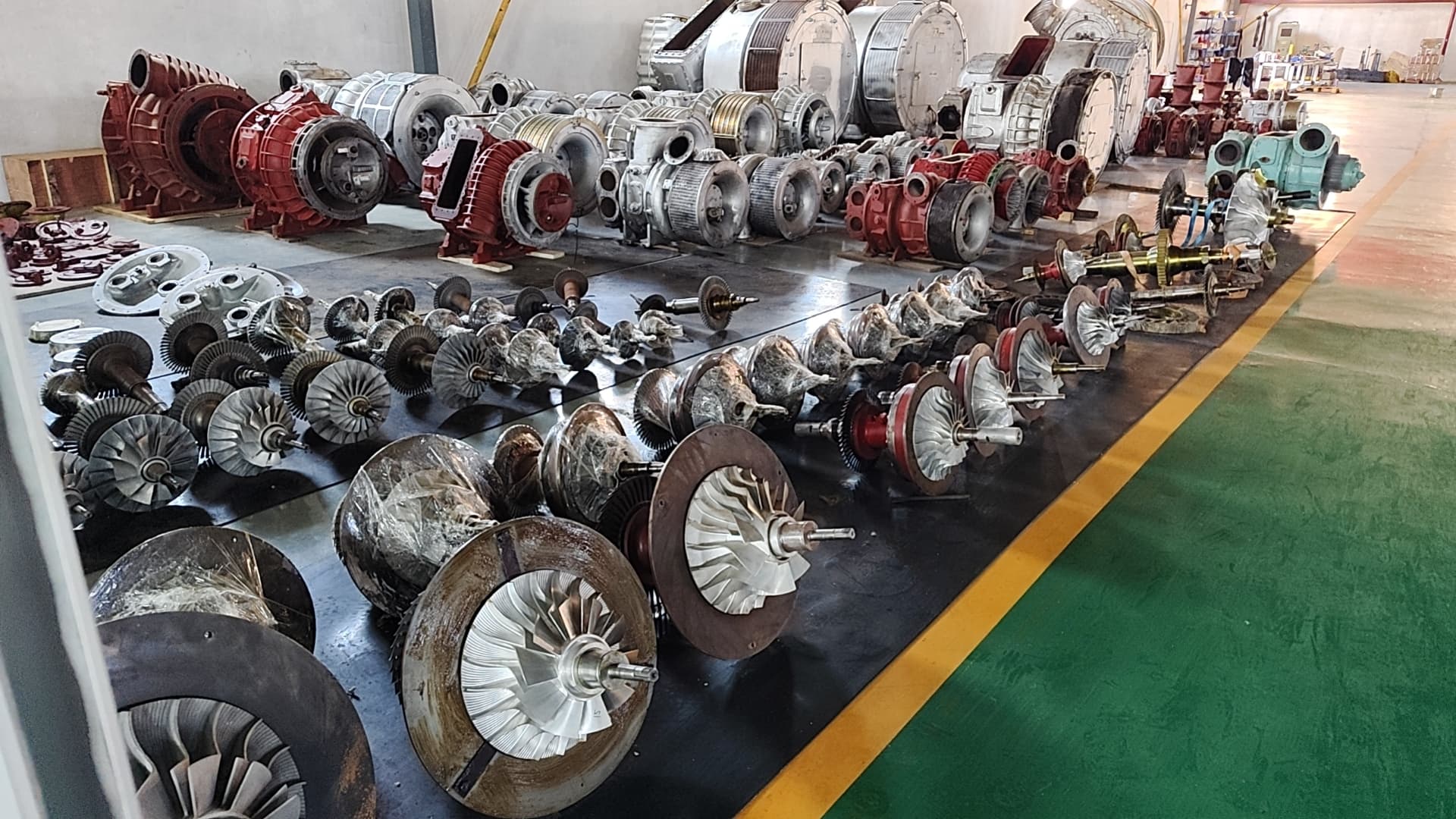 Turbocharger components and rotors arranged in the workshop for overhaul